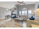 Bright living room featuring a fireplace, modern furniture, and hardwood floors at 1150 Red Margin Ct # 101, Las Vegas, NV 89183