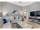 A cozy living room with neutral tones and modern decor creates an inviting atmosphere at 1150 Red Margin Ct # 101, Las Vegas, NV 89183