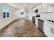 Modern kitchen with stainless steel appliances, white cabinets, and durable floors open to the living room at 1200 Cunningham Dr, Las Vegas, NV 89106