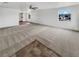 Bright living room featuring carpet flooring, neutral paint, and natural light at 1200 Cunningham Dr, Las Vegas, NV 89106