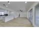 Spacious living room open to a modern kitchen featuring light wood flooring at 1203 Tamerack Ave, Las Vegas, NV 89106