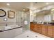 Beautiful bathroom with a glass-enclosed shower, soaking tub, and double sink vanity at 125 E Harmon Ave # 2205, Las Vegas, NV 89109