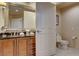 Bathroom vanity and toilet in bathroom with sleek cabinets and modern finishes at 125 E Harmon Ave # 2205, Las Vegas, NV 89109