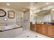 Beautiful bathroom with a glass-enclosed shower, soaking tub, and double sink vanity at 125 E Harmon Ave # 2205, Las Vegas, NV 89109