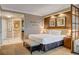 Relaxing bedroom with large bed, a lounge, and spa-like bathroom at 125 E Harmon Ave # 2205, Las Vegas, NV 89109