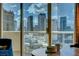 Stunning city view through large windows, offering a picturesque scene of the vibrant cityscape at 125 E Harmon Ave # 2205, Las Vegas, NV 89109