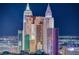 Nighttime city view featuring iconic New York New York hotel and other landmark buildings at 125 E Harmon Ave # 2205, Las Vegas, NV 89109