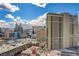 Broad city view featuring high-rise buildings and hotel casinos set against a partially cloudy sky near the mountains at 125 E Harmon Ave # 2205, Las Vegas, NV 89109