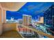 Beautiful nighttime city view from a balcony, showcasing the dazzling lights and bustling cityscape at 125 E Harmon Ave # 2205, Las Vegas, NV 89109