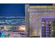 Striking night view of the Park MGM Hotel and the Las Vegas Strip, with city lights creating a vibrant background at 125 E Harmon Ave # 2205, Las Vegas, NV 89109