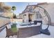 Lush backyard featuring a pool, hot tub, and lounge seating at 1252 Autumn Wind Way, Henderson, NV 89052