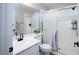 Modern bathroom with white vanity, updated faucet, and tiled shower with glass doors at 1252 Autumn Wind Way, Henderson, NV 89052