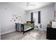 Cozy bedroom with wood floors, playful decor, and natural light at 1252 Autumn Wind Way, Henderson, NV 89052