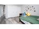 Comfortable bedroom with wood floors and a closet at 1252 Autumn Wind Way, Henderson, NV 89052