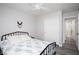 Cozy bedroom with ceiling fan, double door closet, and comfortable bed with access to the bathroom at 1252 Autumn Wind Way, Henderson, NV 89052