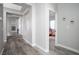 Hallway with art and doorways leading to the main bedroom and a room at 1252 Autumn Wind Way, Henderson, NV 89052