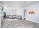 Spacious living room with modern decor, gray sectional sofa, and an open layout with great natural light at 1252 Autumn Wind Way, Henderson, NV 89052