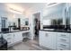 The main bathroom has dual sinks with granite countertops, mirrors, and a walk-in closet at 1252 Autumn Wind Way, Henderson, NV 89052