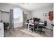 Spacious office with light-colored wood floors, large window, and multiple workstations at 1252 Autumn Wind Way, Henderson, NV 89052