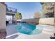 Backyard pool and hot tub with lounging area at 1252 Autumn Wind Way, Henderson, NV 89052