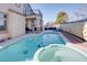 Backyard with a pool and spa surrounded by hardscape at 1252 Autumn Wind Way, Henderson, NV 89052