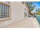 This balcony has a tan foundation with glass box windows and a white wall at 2020 Rainbow View St, Henderson, NV 89012