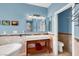 Bright bathroom with tile floors, vessel sink, and natural light at 2020 Rainbow View St, Henderson, NV 89012