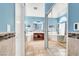 Bright bathroom with tile floors, freestanding tub, and glass-enclosed shower at 2020 Rainbow View St, Henderson, NV 89012