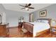 Cozy bedroom with hardwood floors, natural light, and ceiling fan at 2020 Rainbow View St, Henderson, NV 89012