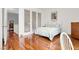 Bedroom with hardwood flooring, view of stairs, and a serene atmosphere at 2020 Rainbow View St, Henderson, NV 89012