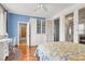 Comfortable bedroom with large closet, ceiling fan, hardwood floors, and access to bathroom at 2020 Rainbow View St, Henderson, NV 89012