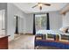 Bedroom with carpet, mirror sliding closet doors, and ceiling fan, offering a comfortable and practical design at 2020 Rainbow View St, Henderson, NV 89012