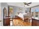 Bright bedroom with hardwood floors, ceiling fan, and natural light at 2020 Rainbow View St, Henderson, NV 89012