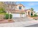 Charming two-story home with a well-manicured front yard and a three-car garage at 2020 Rainbow View St, Henderson, NV 89012