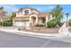 Charming two-story home with a well-manicured front yard and a three-car garage at 2020 Rainbow View St, Henderson, NV 89012