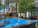 Interactive splash fountain surrounded by patio furniture in a vibrant commercial area at 2020 Rainbow View St, Henderson, NV 89012