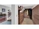 Hallway with coat closet featuring wood paneling and rod for hanging coats at 2020 Rainbow View St, Henderson, NV 89012