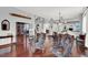Elegant living room with hardwood floors, staircase, and classic furnishings at 2020 Rainbow View St, Henderson, NV 89012