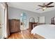 Bright bedroom with hardwood floors and archway entrance to the bathroom at 2020 Rainbow View St, Henderson, NV 89012