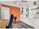 Bright office features built in shelving, a ceiling fan, and wood floors at 2020 Rainbow View St, Henderson, NV 89012