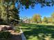 A gorgeous park with luscious grass and tall trees at 2020 Rainbow View St, Henderson, NV 89012