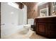 Cozy bathroom featuring a tub/shower combo and warm wood vanity at 2050 W Warm Springs Rd # 4322, Henderson, NV 89014
