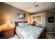 Bedroom featuring a ceiling fan, closet with mirrored doors, and a comfortable bed at 2050 W Warm Springs Rd # 4322, Henderson, NV 89014