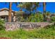 Landscaped sign for Resort Villas at the Wildhorse Golf Club with palm trees and attractive architecture at 2050 W Warm Springs Rd # 4322, Henderson, NV 89014