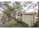 Well-maintained condo building featuring manicured landscaping and tan stucco exterior at 2050 W Warm Springs Rd # 4322, Henderson, NV 89014