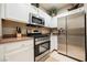 Modern kitchen featuring stainless steel appliances, white cabinets, and neutral countertops at 2050 W Warm Springs Rd # 4322, Henderson, NV 89014
