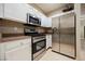 A well-equipped kitchen with stainless steel appliances and bright white cabinets at 2050 W Warm Springs Rd # 4322, Henderson, NV 89014