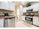 Modern kitchen with stainless steel appliances and white cabinets at 2050 W Warm Springs Rd # 4322, Henderson, NV 89014