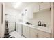 Functional laundry room with white cabinets, a utility sink, and washer and dryer at 2050 W Warm Springs Rd # 4322, Henderson, NV 89014