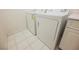 Laundry area with white appliances and tile flooring at 2050 W Warm Springs Rd # 4322, Henderson, NV 89014